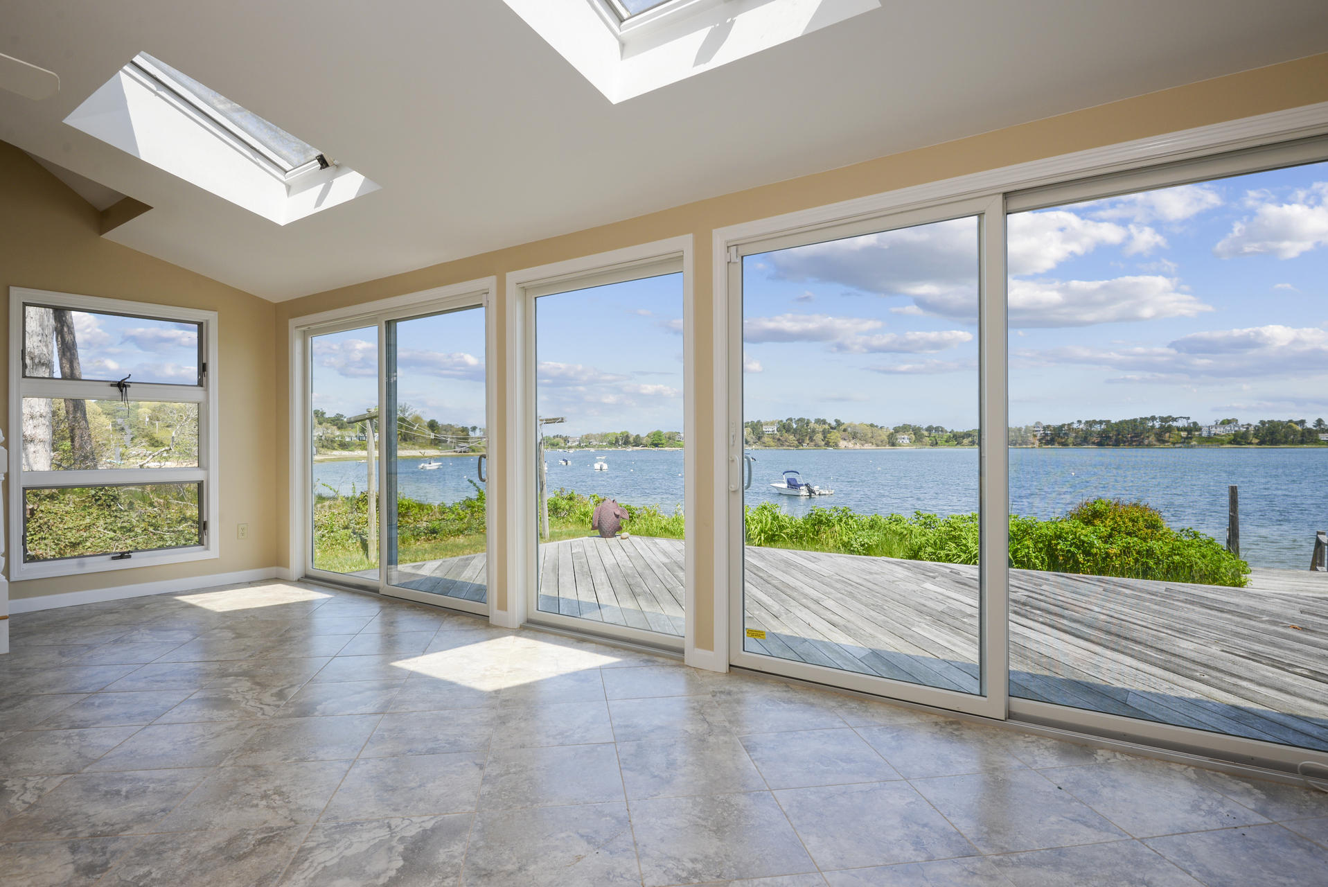 159 Seapine Road North Chatham, MA 02650 - Photo 3 of 31 a view of an empty room with wooden floor and a large window