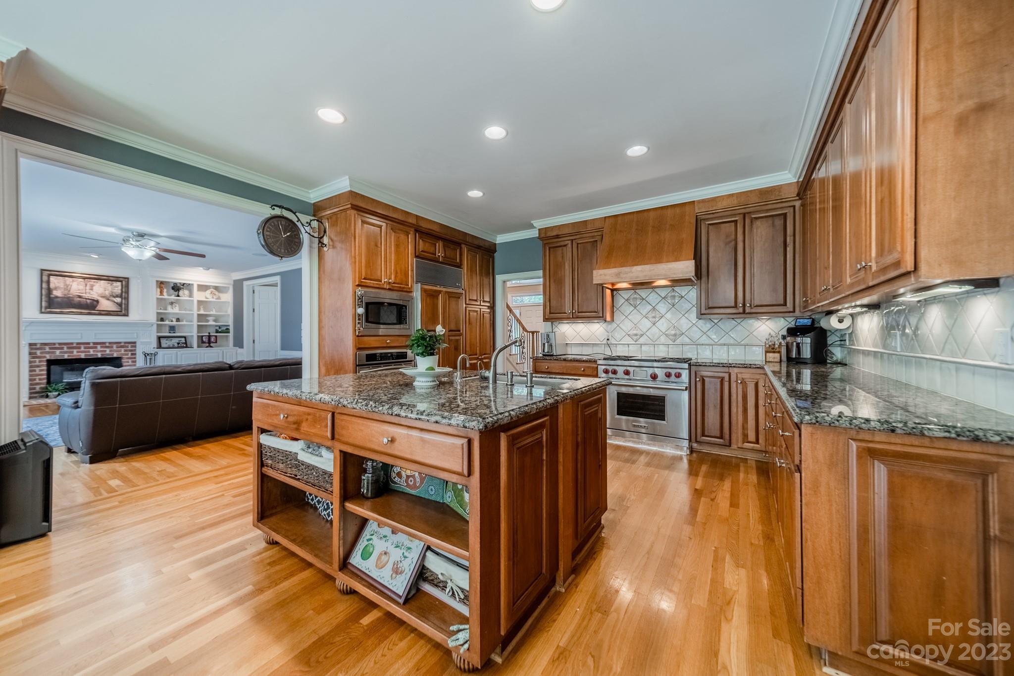 1439 Windy Ridge Road Charlotte, NC 28270 - Photo 14 of 46 a kitchen with stainless steel appliances granite countertop a stove a sink and a refrigerator