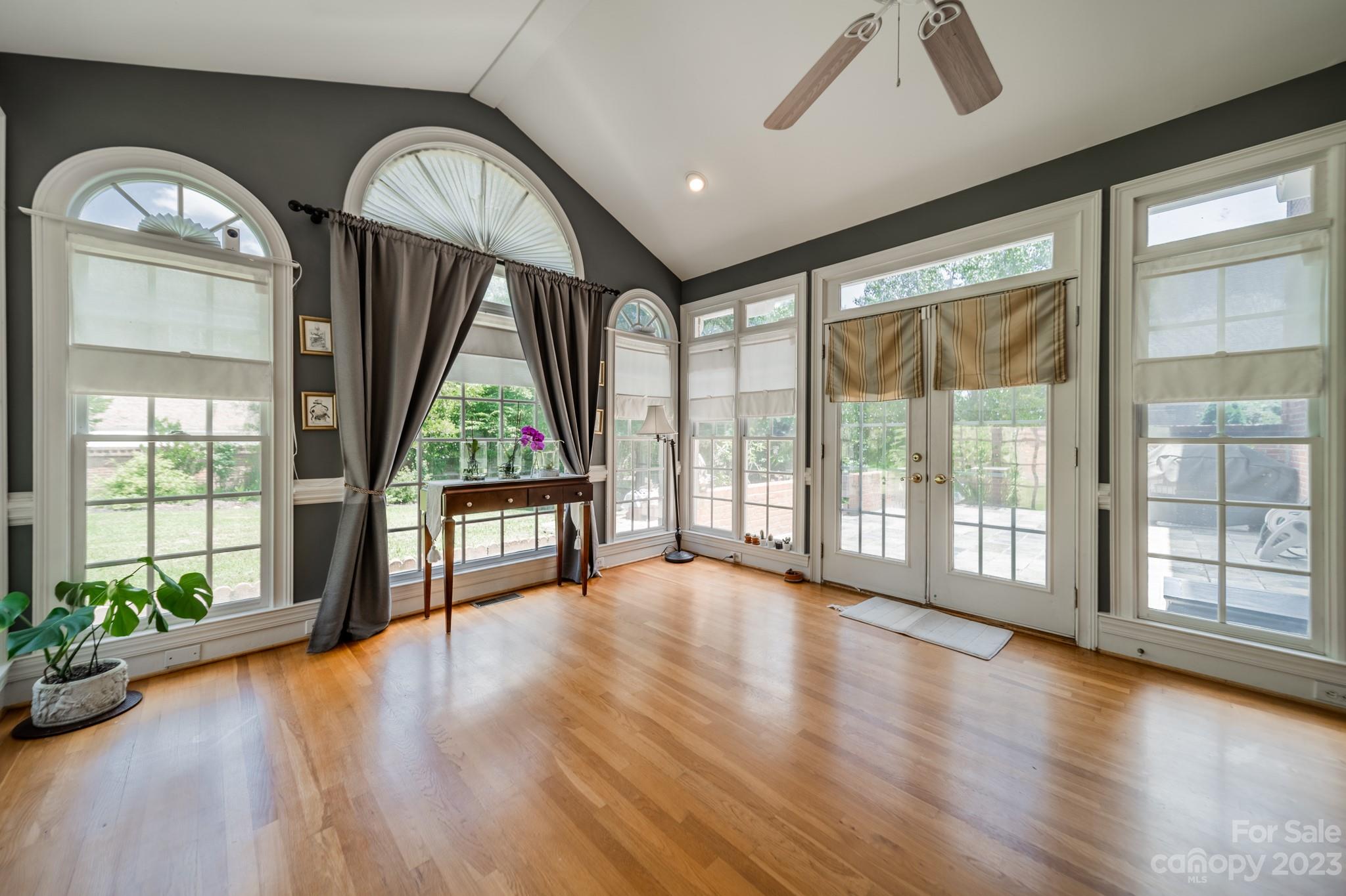 1439 Windy Ridge Road Charlotte, NC 28270 - Photo 19 of 46 a view of empty room with wooden floor and fan