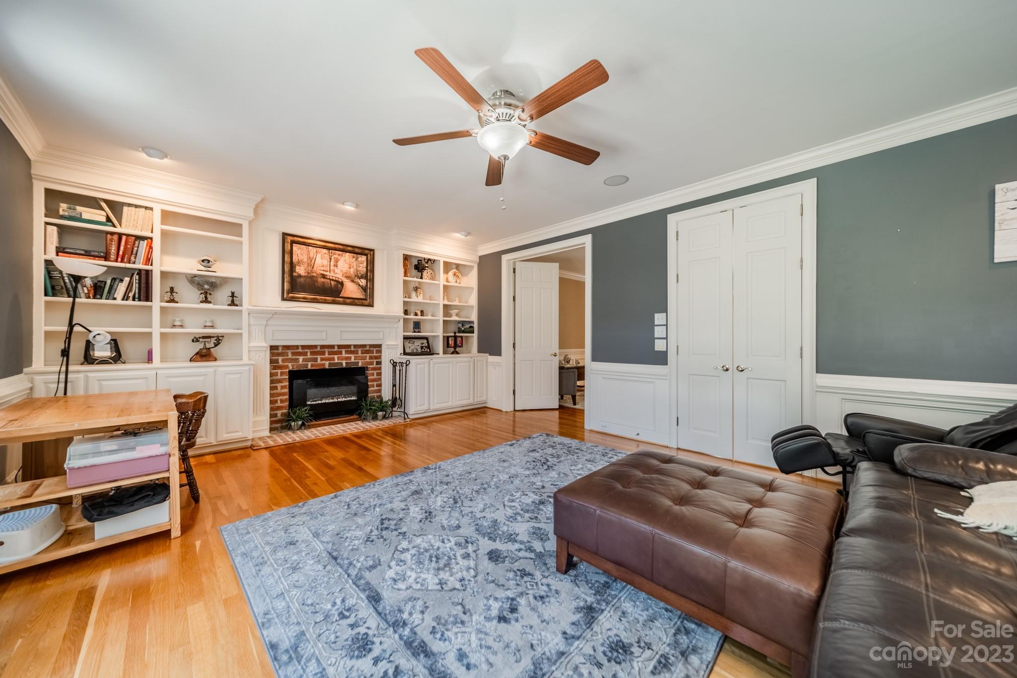 1439 Windy Ridge Road Charlotte, NC 28270 - Photo 20 of 46 a living room with furniture or couch and a fireplace