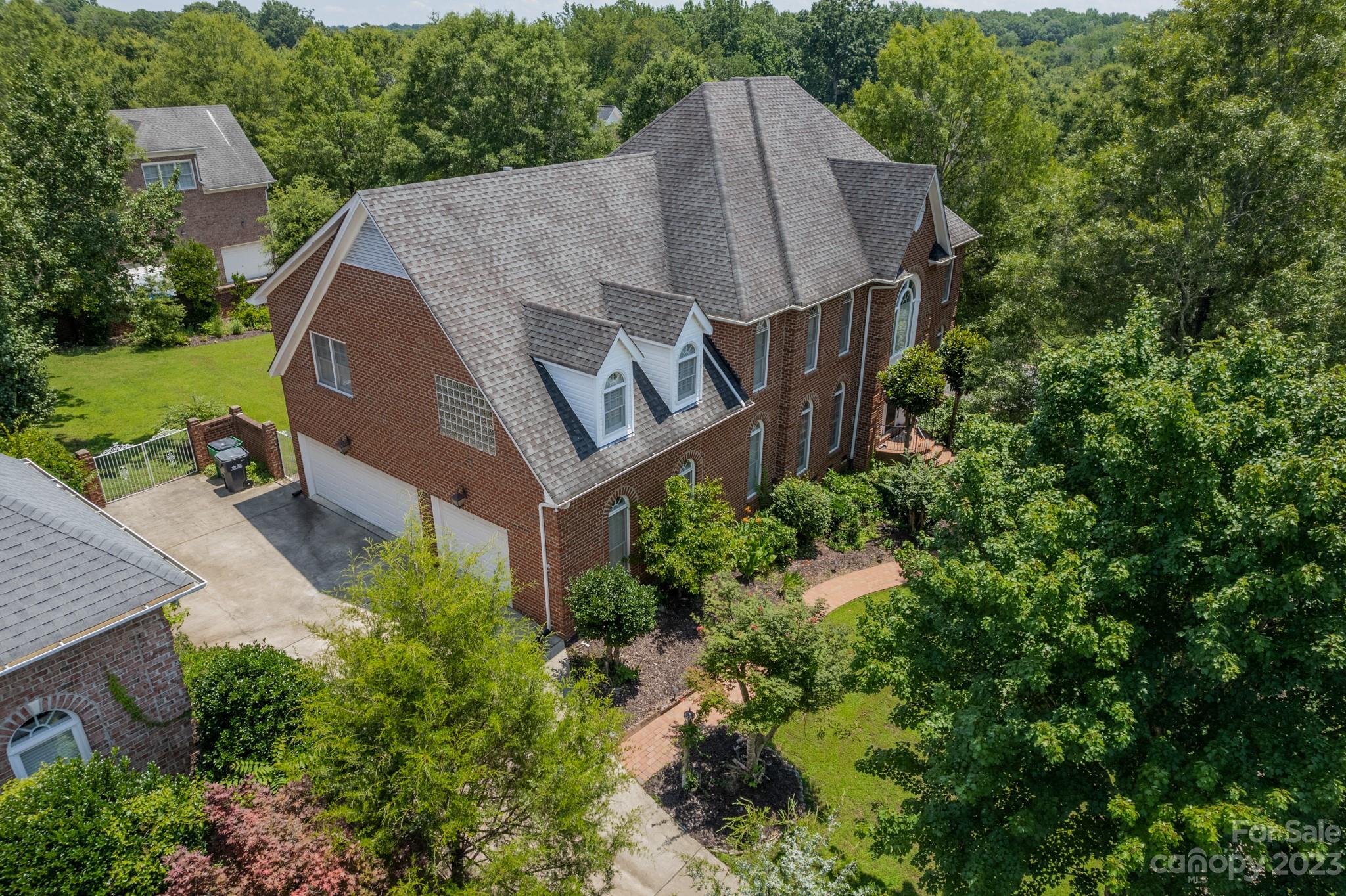 1439 Windy Ridge Road Charlotte, NC 28270 - Photo 2 of 46 an aerial view of a house with garden space and trees