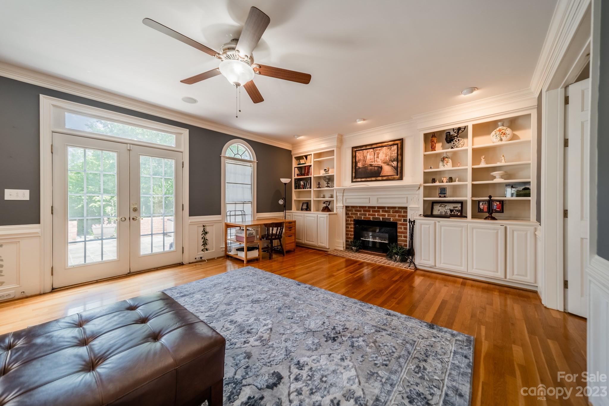 1439 Windy Ridge Road Charlotte, NC 28270 - Photo 21 of 46 a living room with furniture and a fireplace