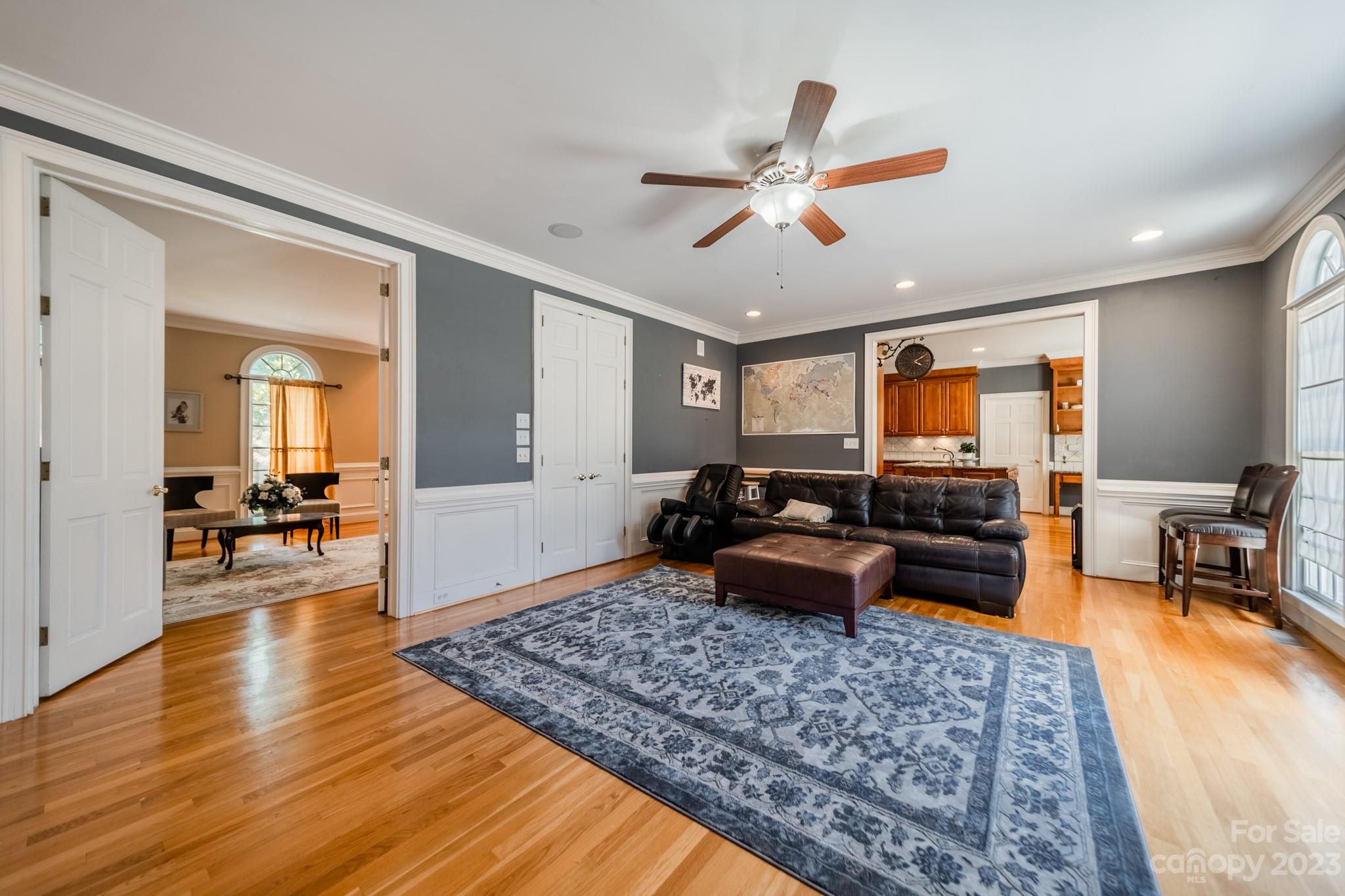 1439 Windy Ridge Road Charlotte, NC 28270 - Photo 23 of 46 a living room with furniture and wooden floor