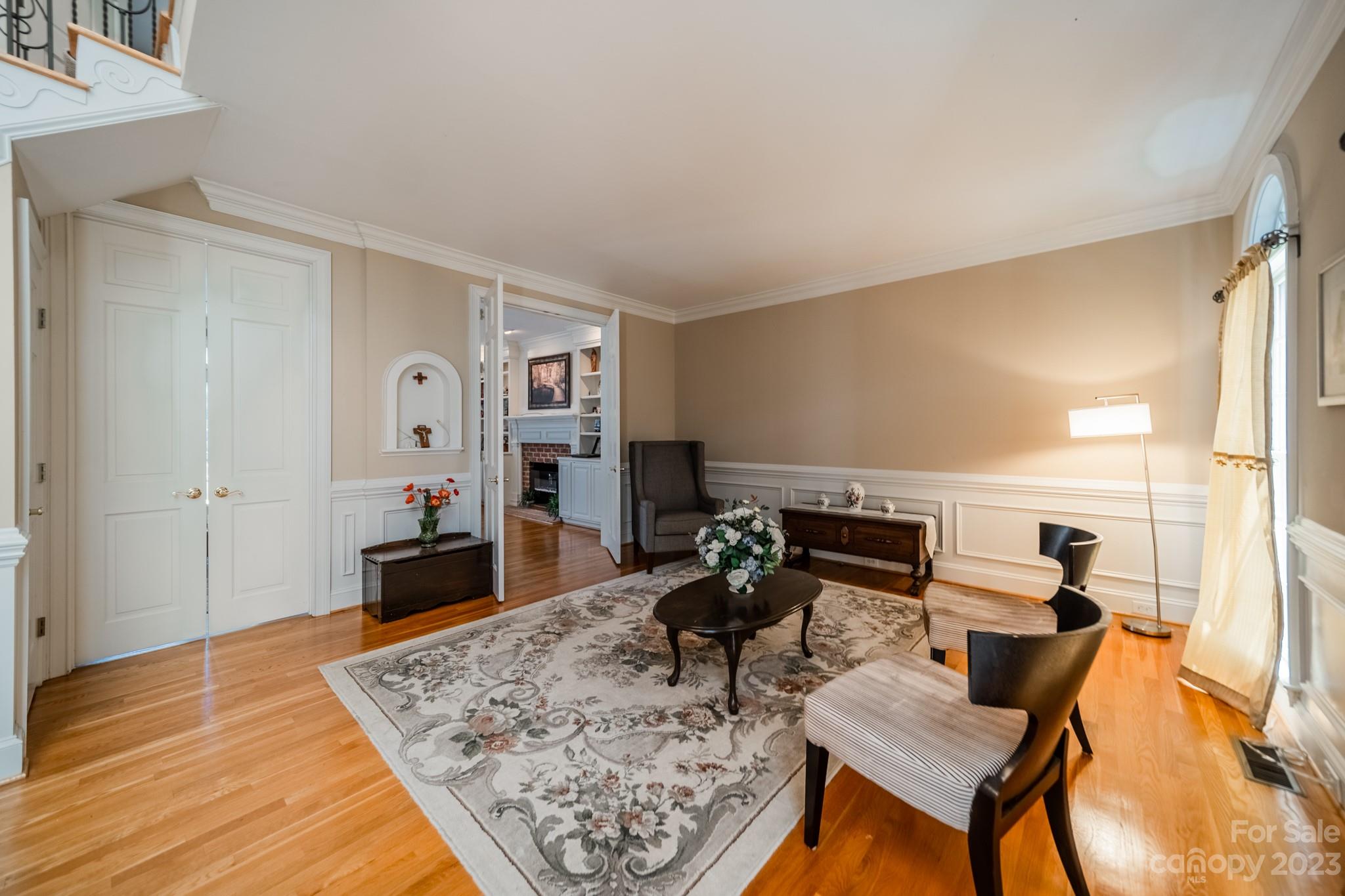 1439 Windy Ridge Road Charlotte, NC 28270 - Photo 24 of 46 a living room with furniture and wooden floor