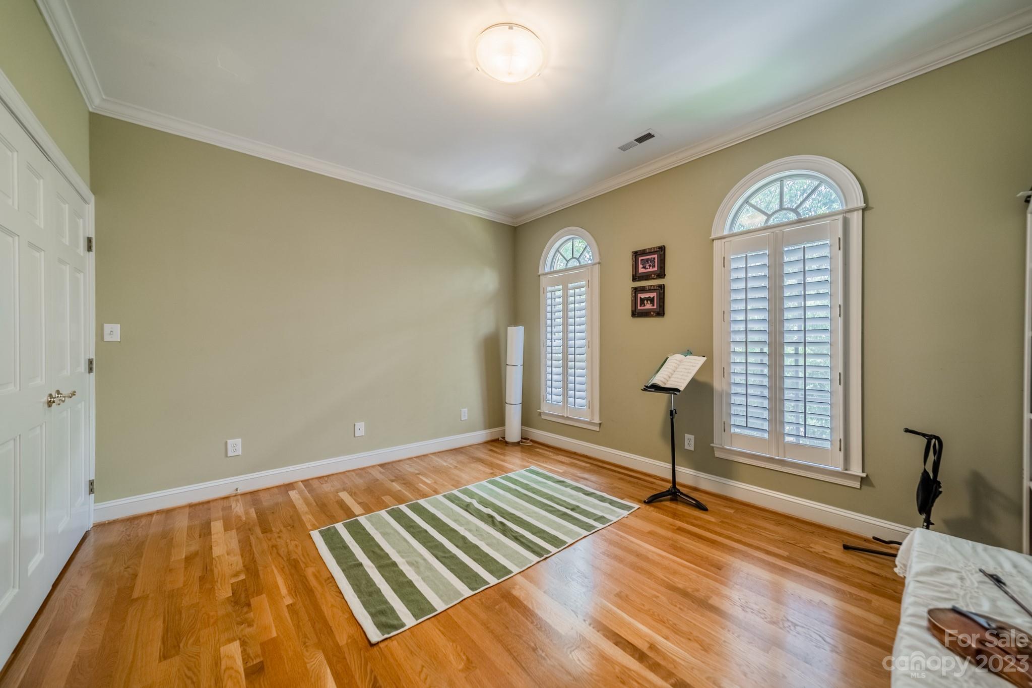 1439 Windy Ridge Road Charlotte, NC 28270 - Photo 28 of 46 a view of a livingroom with wooden floor and a large window
