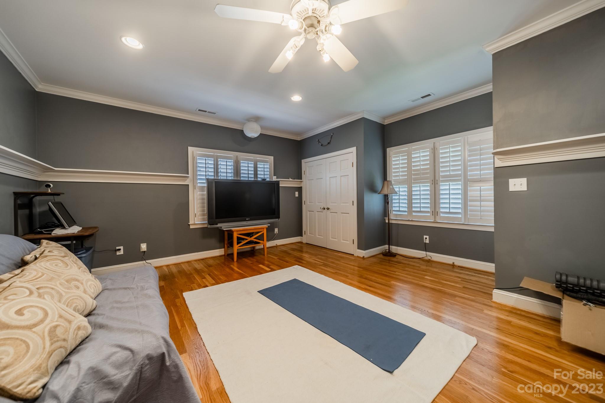 1439 Windy Ridge Road Charlotte, NC 28270 - Photo 31 of 46 a bedroom with a bed and a flat screen tv