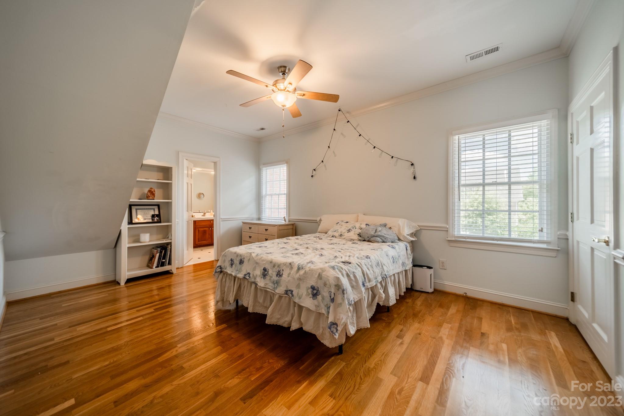 1439 Windy Ridge Road Charlotte, NC 28270 - Photo 32 of 46 a spacious bedroom with a bed and a large window