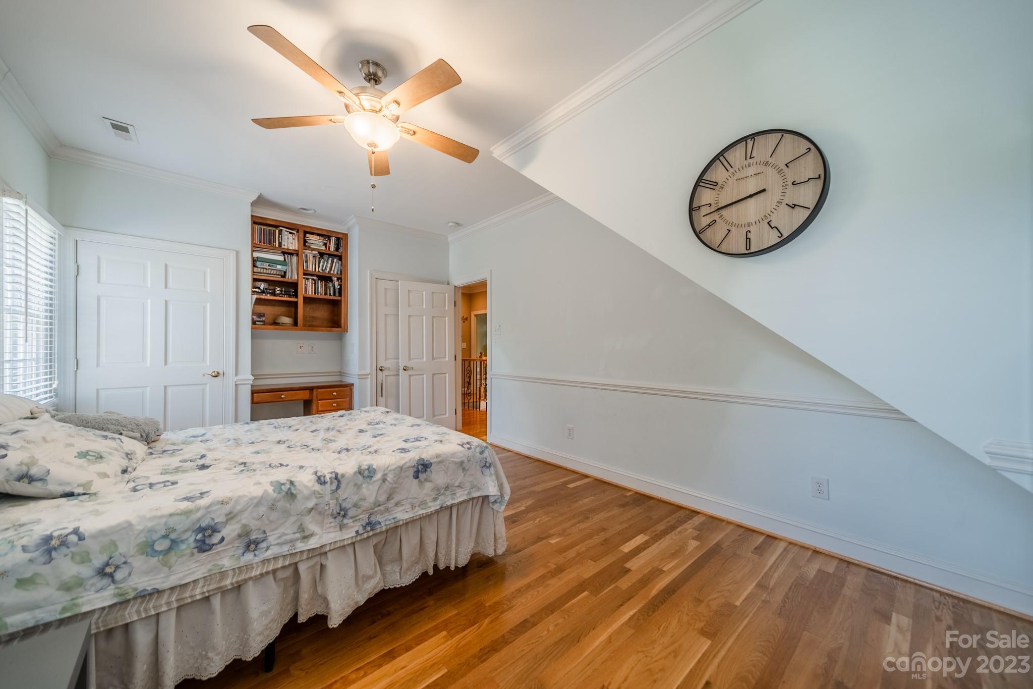 1439 Windy Ridge Road Charlotte, NC 28270 - Photo 33 of 46 a bedroom with a large bed and a chandelier