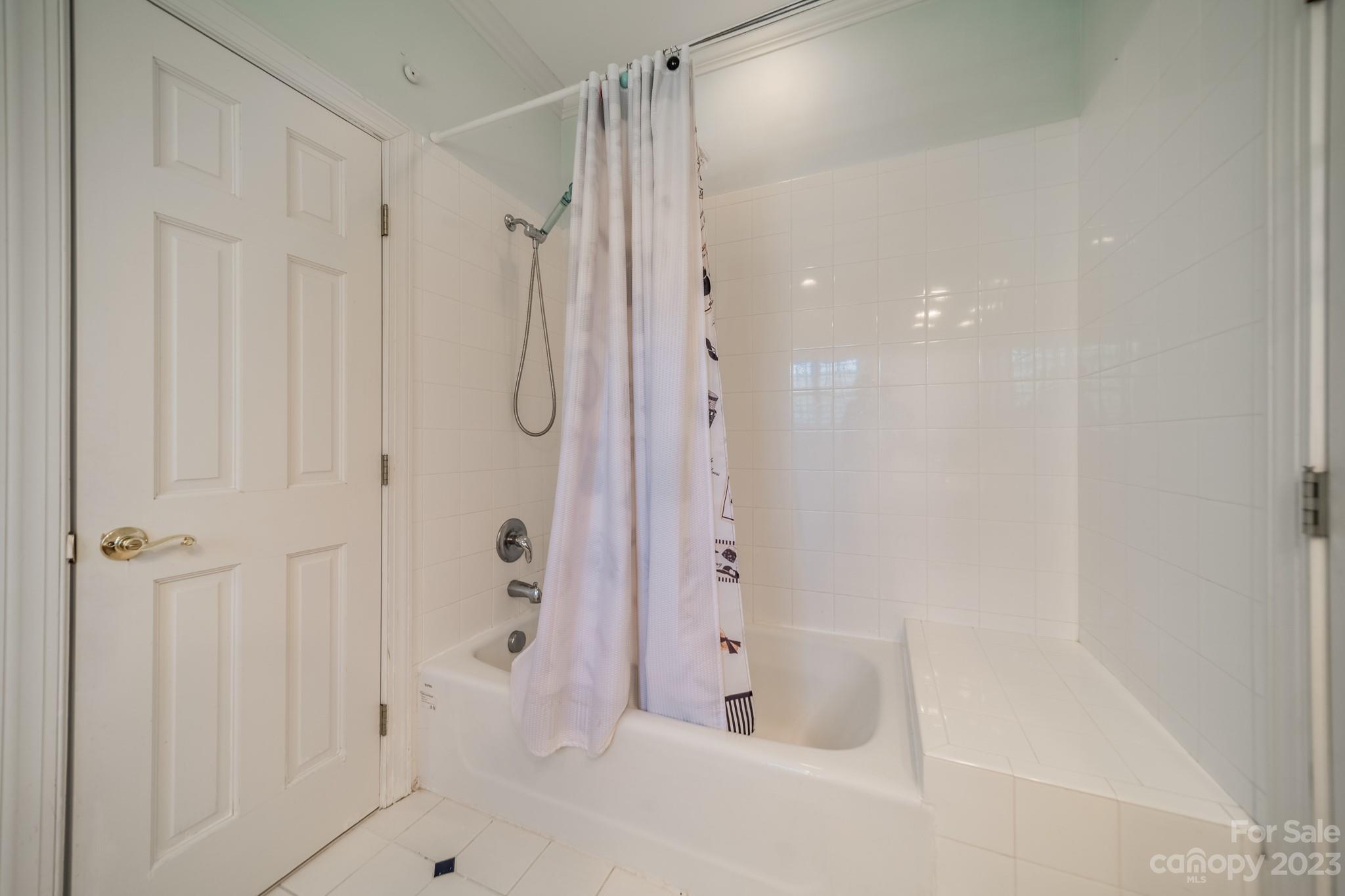 1439 Windy Ridge Road Charlotte, NC 28270 - Photo 35 of 46 a bathroom with a bathtub and a shower