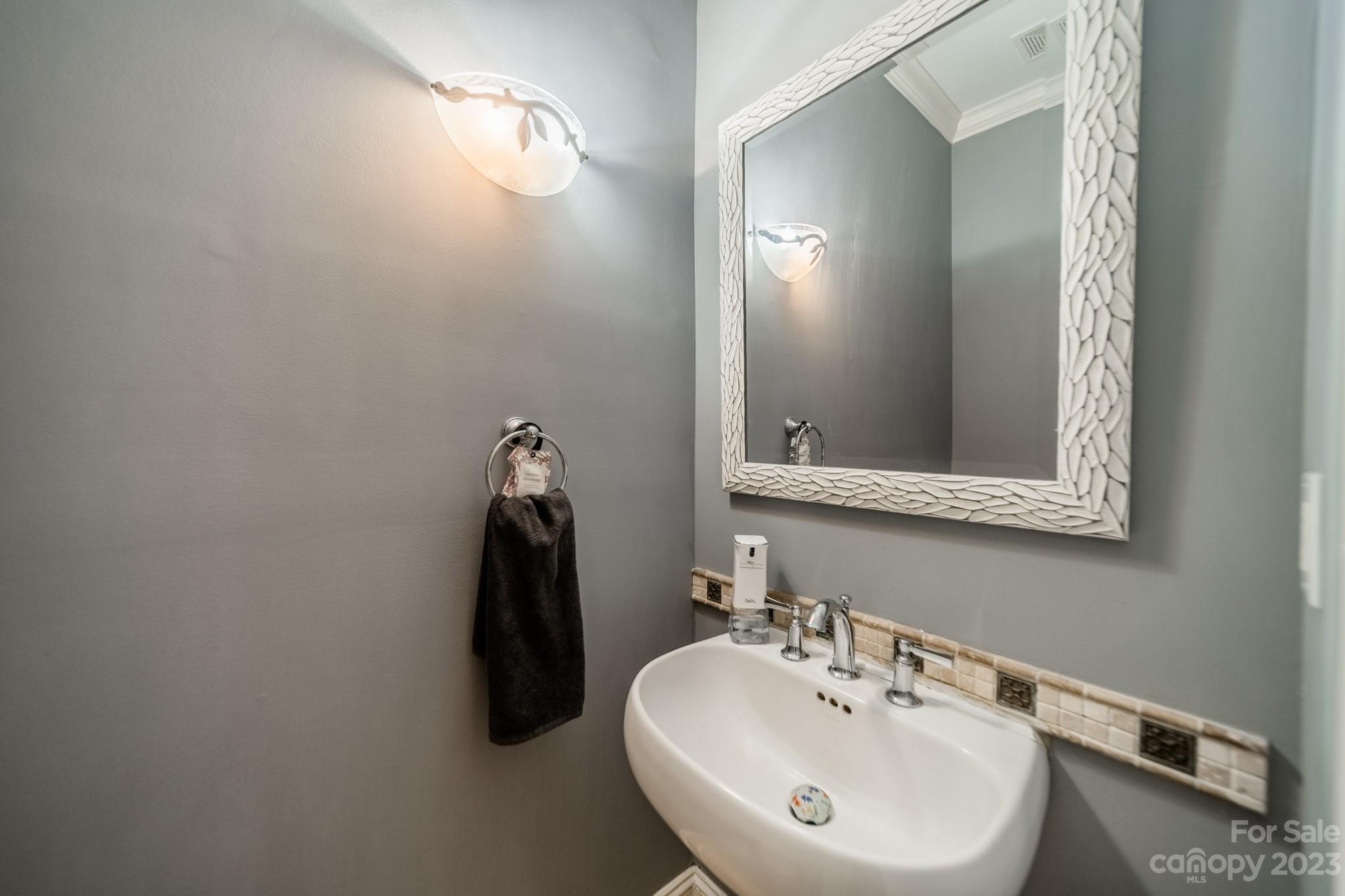 1439 Windy Ridge Road Charlotte, NC 28270 - Photo 38 of 46 a bathroom with a sink and a mirror