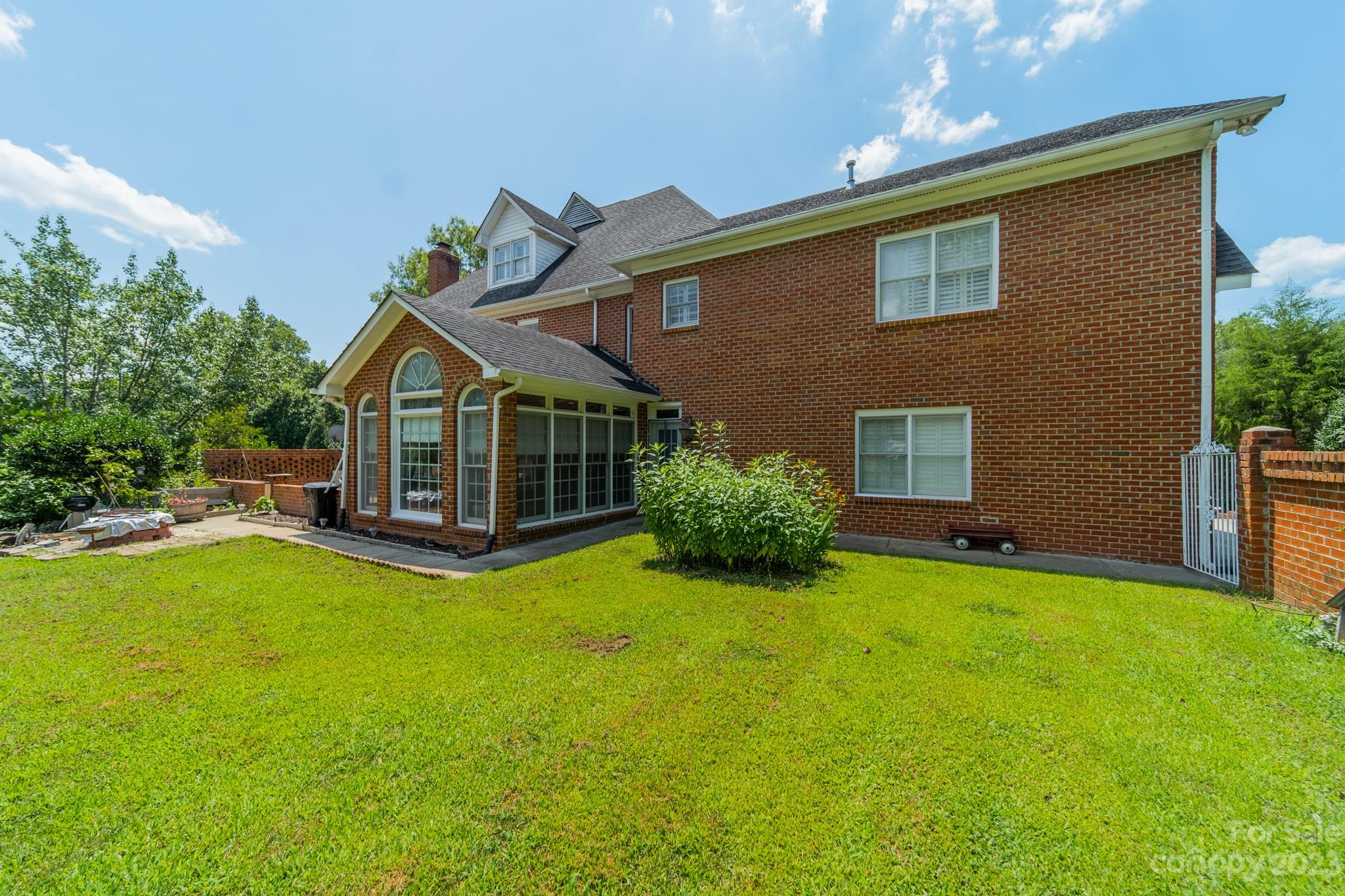 1439 Windy Ridge Road Charlotte, NC 28270 - Photo 40 of 46 a front view of a house with yard and green space