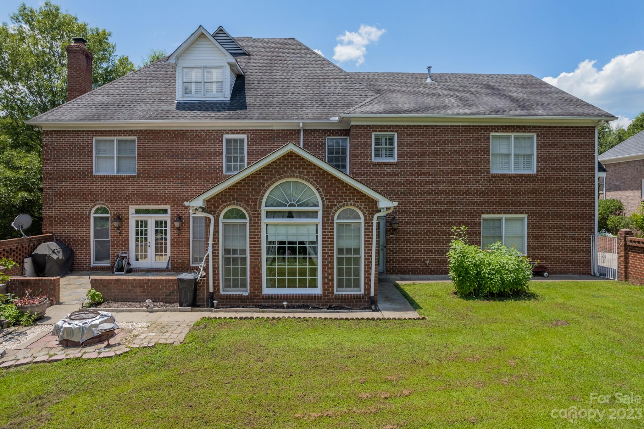 1439 Windy Ridge Road Charlotte, NC 28270 - Photo 4 of 46 a front view of a house with a yard and porch