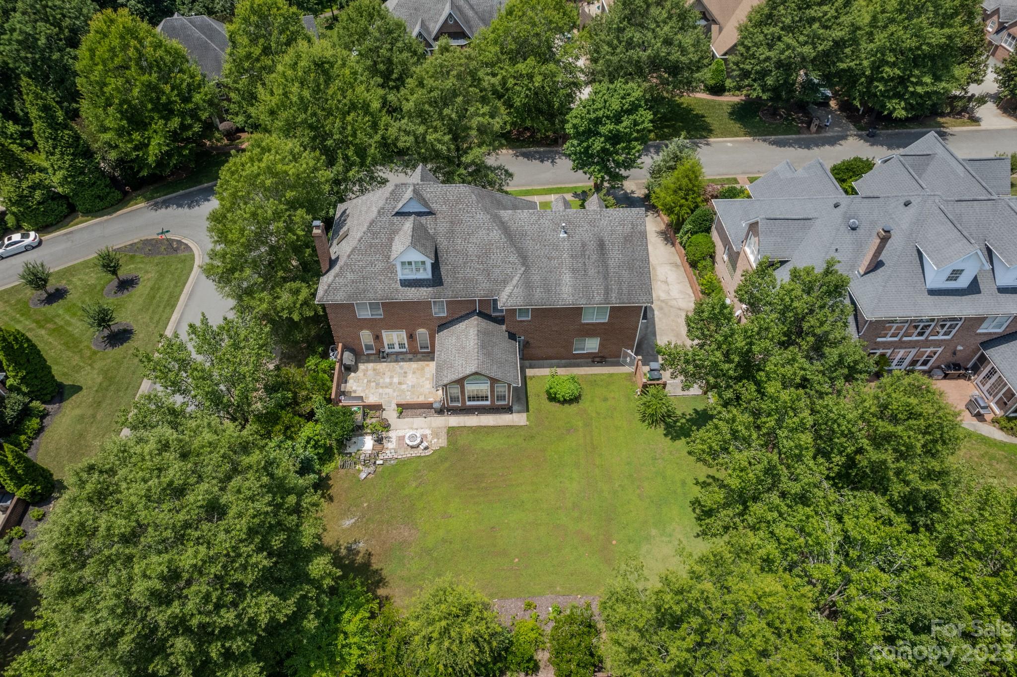 1439 Windy Ridge Road Charlotte, NC 28270 - Photo 45 of 46 an aerial view of a house with swimming pool and large trees