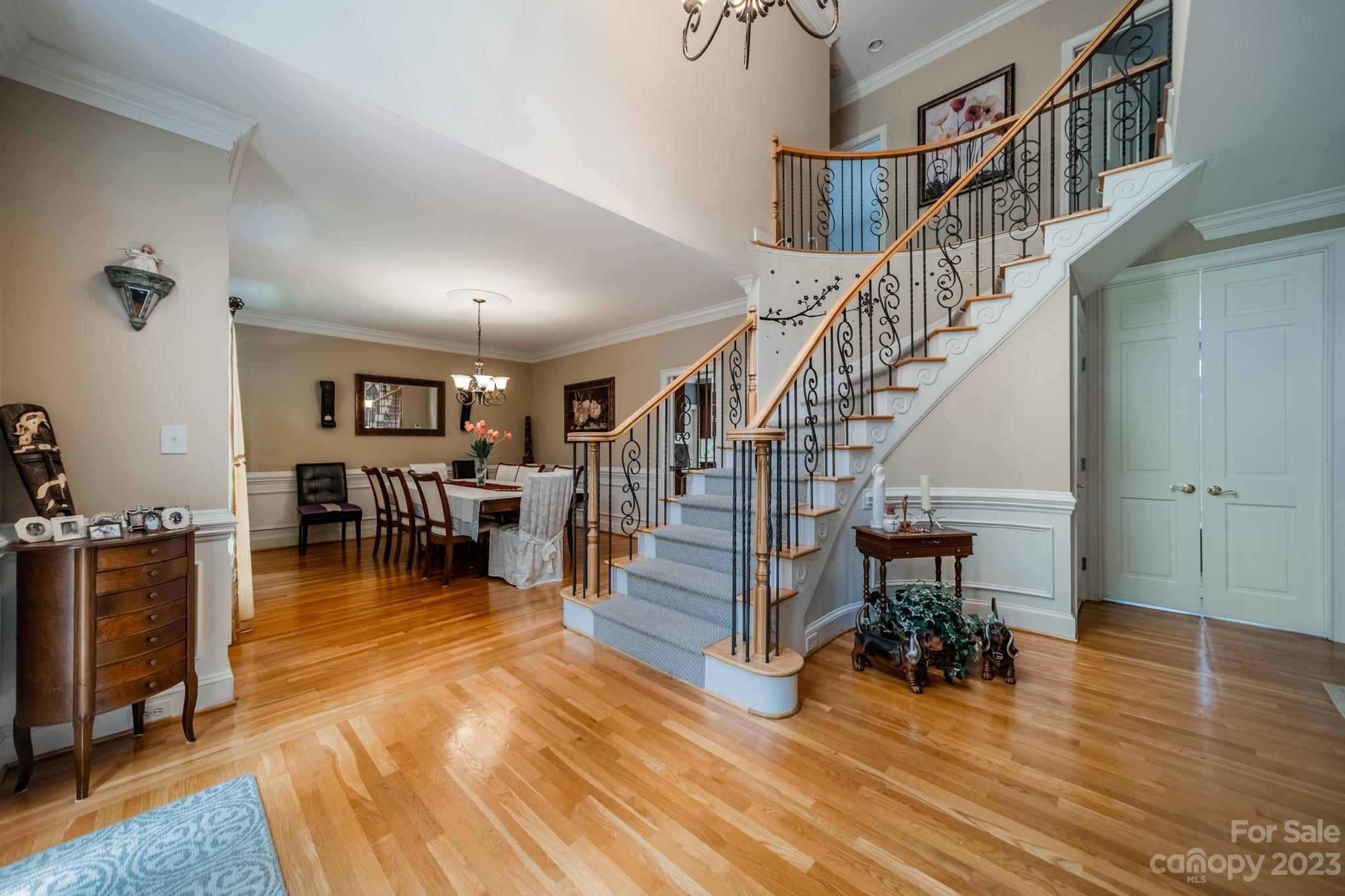 1439 Windy Ridge Road Charlotte, NC 28270 - Photo 5 of 46 a dining room with furniture entryway and wooden floor