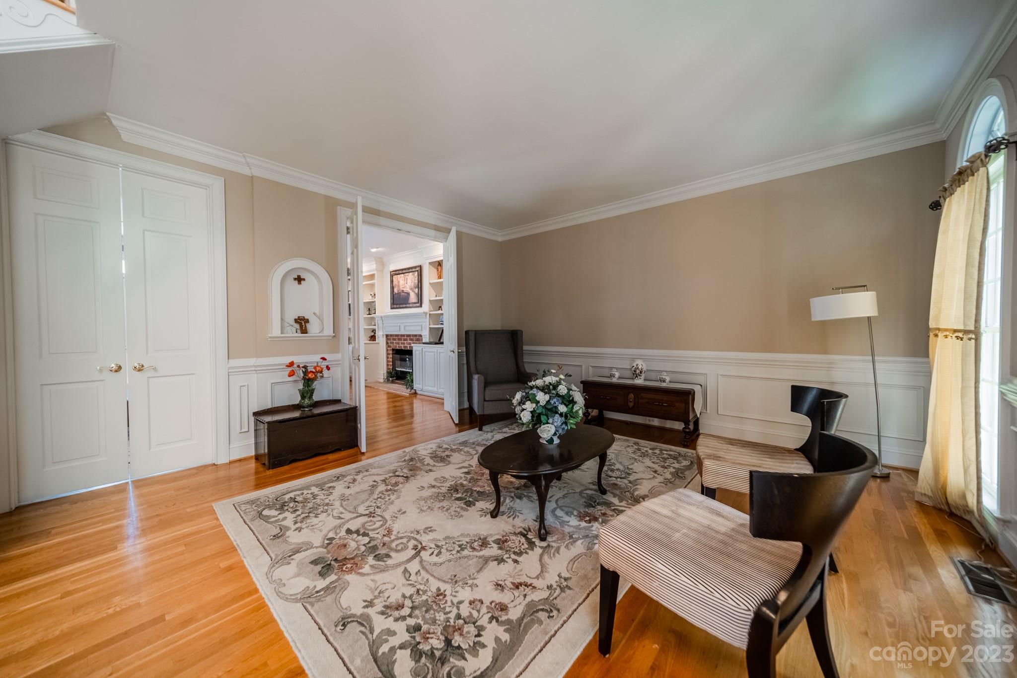 1439 Windy Ridge Road Charlotte, NC 28270 - Photo 6 of 46 a living room with furniture and a wooden floor