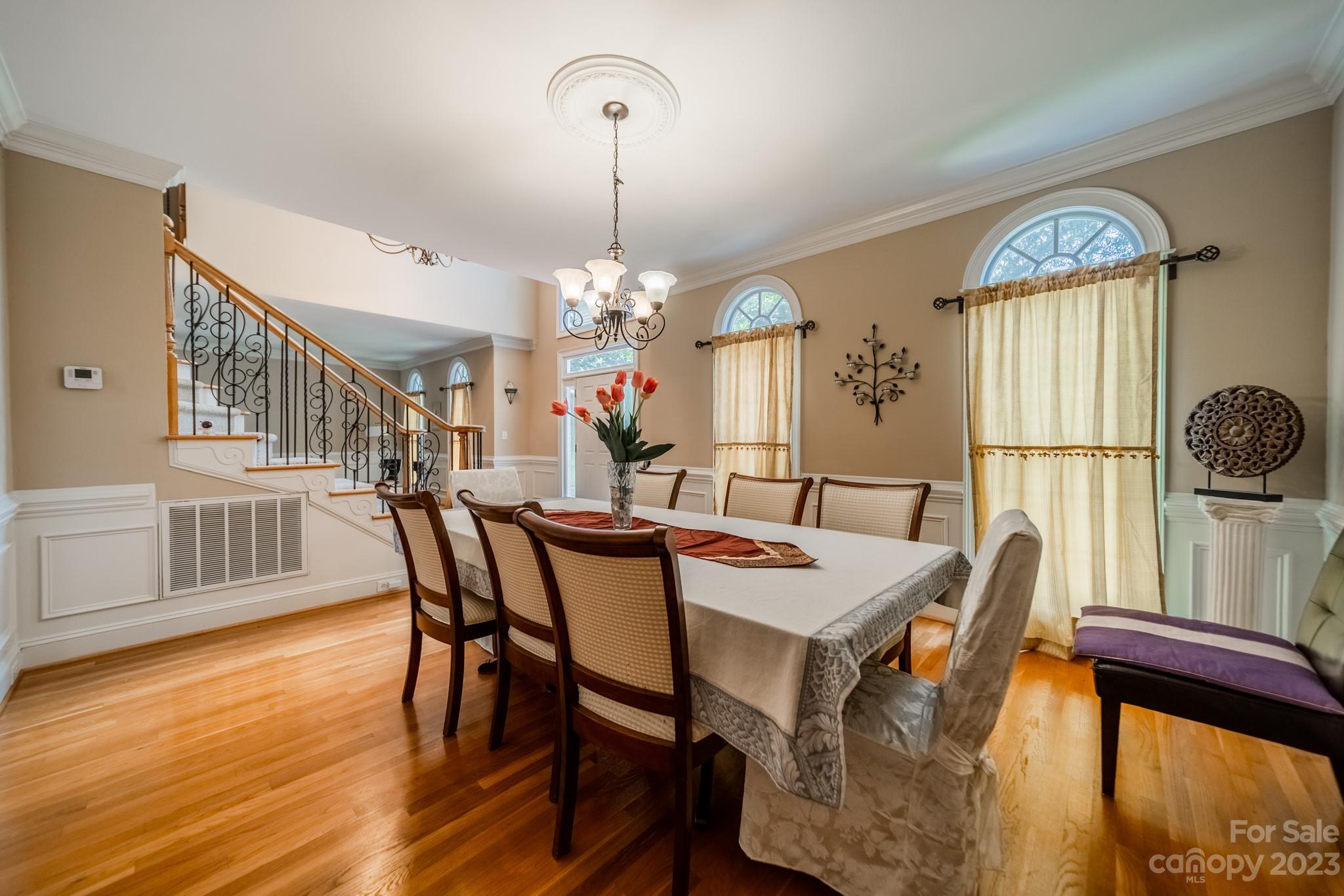 1439 Windy Ridge Road Charlotte, NC 28270 - Photo 9 of 46 a view of a dining room with furniture window and wooden floor