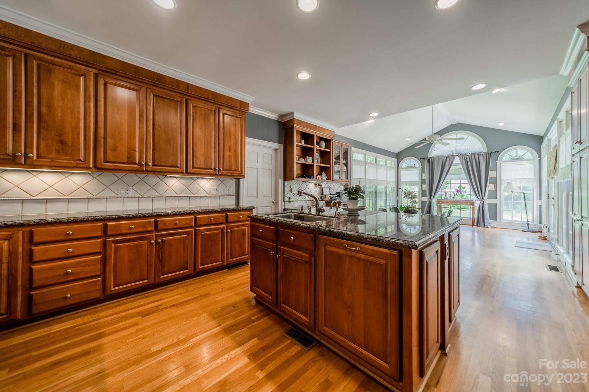 1439 Windy Ridge Road Charlotte, NC 28270 - Photo 10 of 46 a kitchen with stainless steel appliances granite countertop wooden cabinets a sink and dishwasher