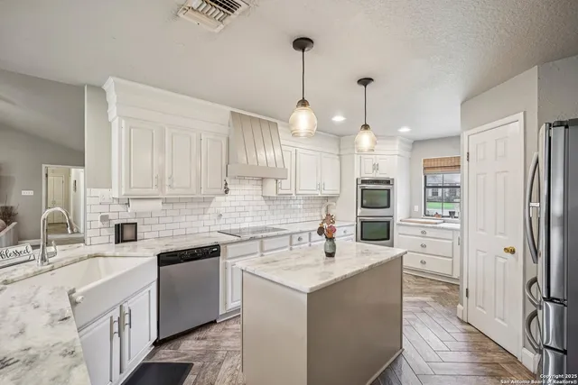a bedroom with a bed a couch and a large window