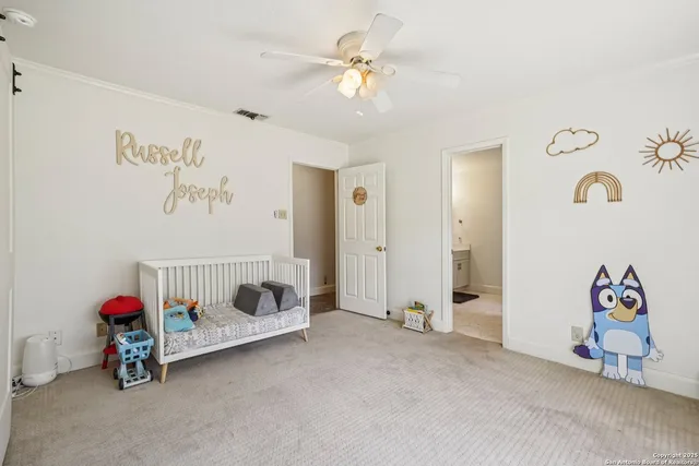 a view of a storage and utility room with washer and dryer