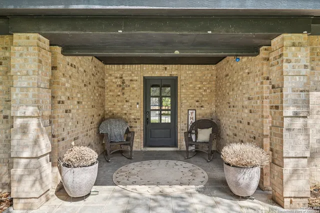 a living room with furniture fireplace and flat screen tv