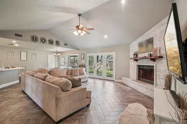 a living room with furniture and a fireplace