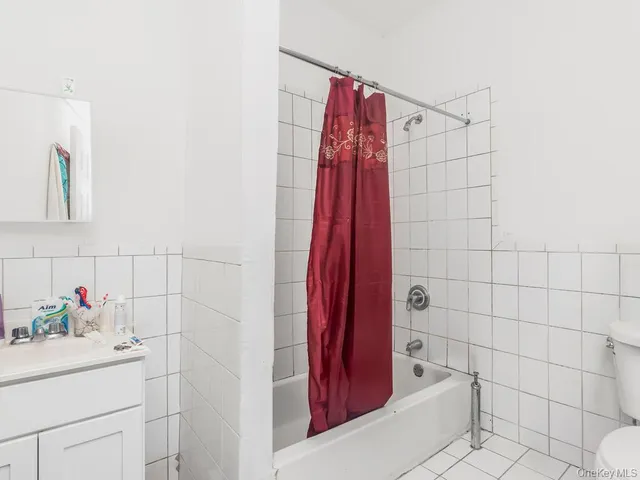 a bathroom with a shower and a sink