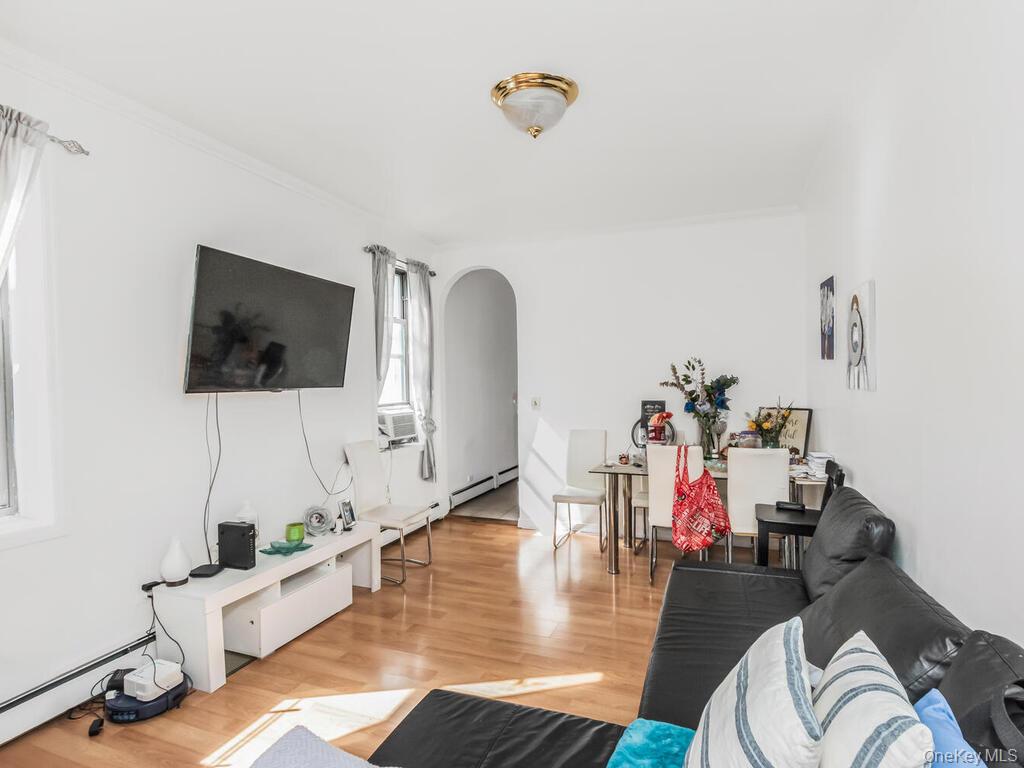 2108 Arthur Avenue Bronx, NY 10457 - Photo 2 of 12 a living room with furniture and a flat screen tv