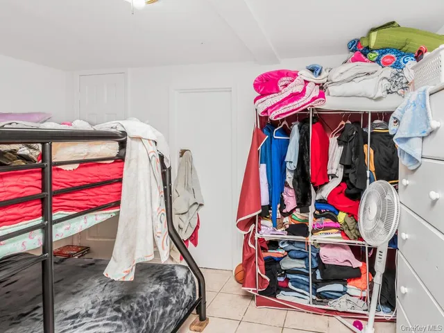 a view of walk in closet with clothes