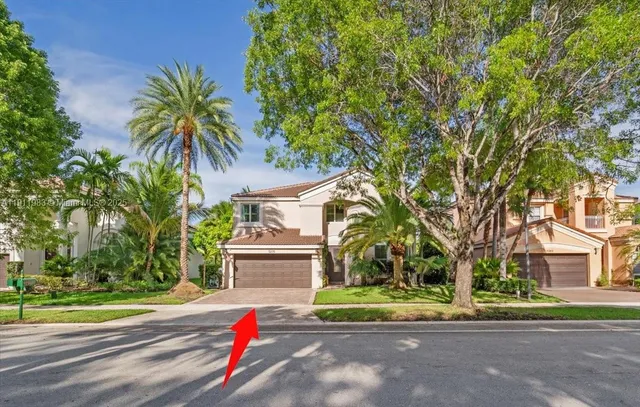 a living room with furniture and a large mirror