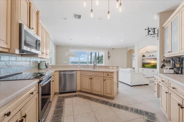 a large bathroom with a double vanity sink a large mirror and a bathtub