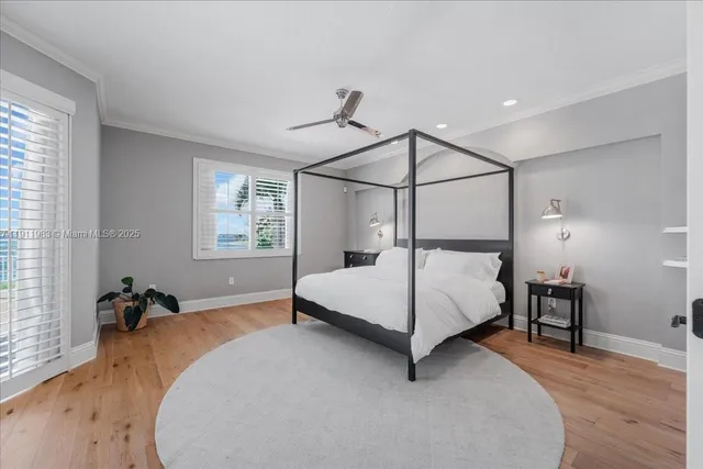 a kitchen with stainless steel appliances kitchen island granite countertop a refrigerator and a sink