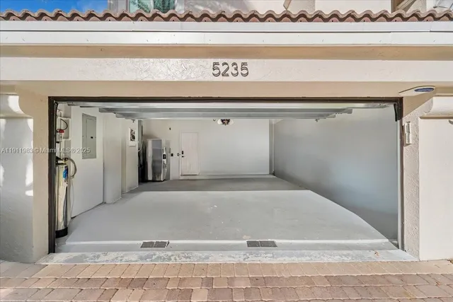 an aerial view of a city with lots of residential buildings lake and ocean view