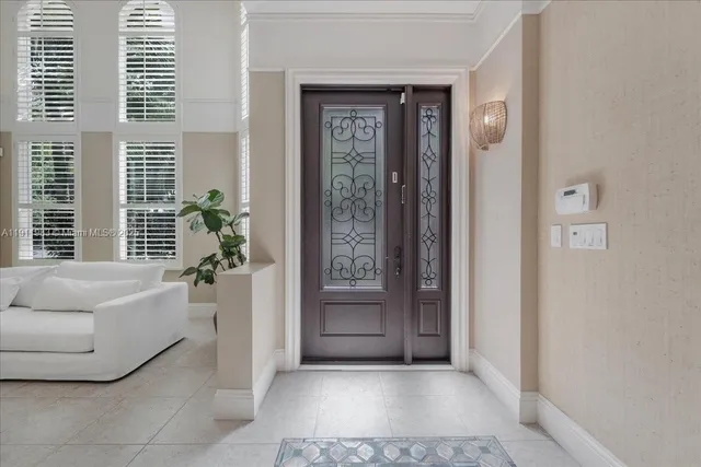 a view of entryway dining room and hall with wooden floor