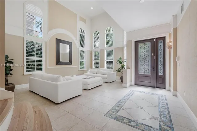 a house view with swimming pool and garden space