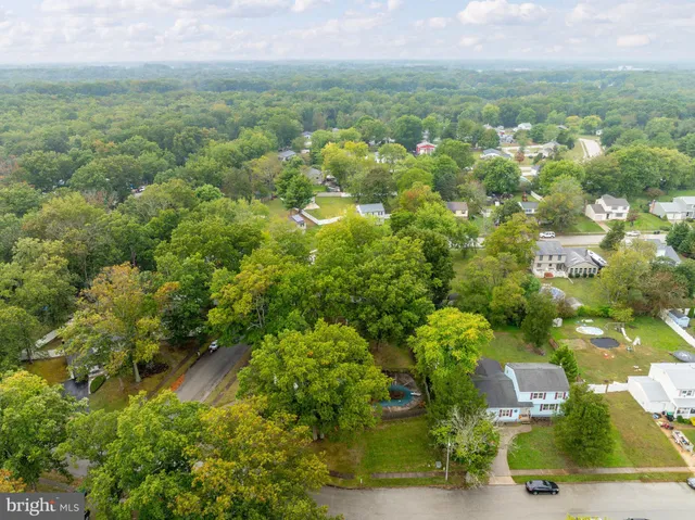 an aerial view of a houses with yard