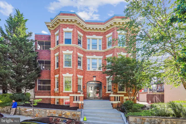 a front view of a multi story residential apartment buildings