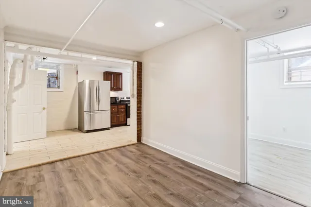 a view of a storage & utility room with a sink