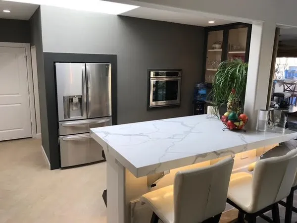 a kitchen with a sink stove and cabinets