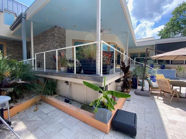 a view of a swimming pool with a patio