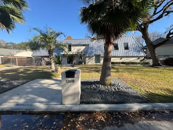 a view of a swimming pool with a table and chairs