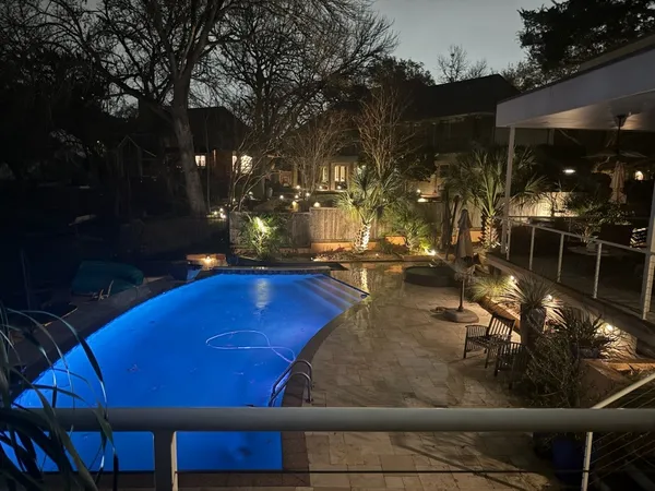 a view of a backyard with sitting area