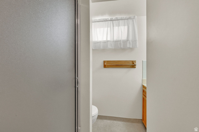2467 South 2000 West Syracuse, UT 84075 - Photo 22 of 28 Frosted glass shower enclosure, white walls, and a small window featuring a white valance