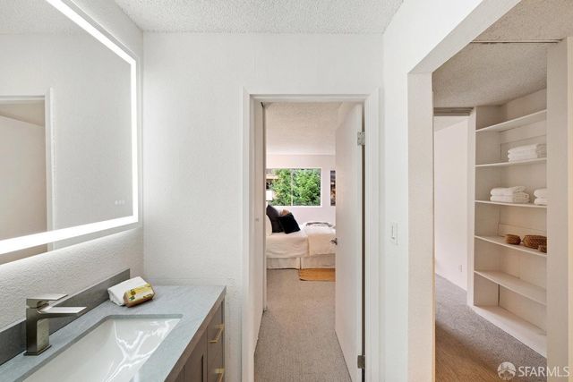 a view of kitchen and bathroom with a sink