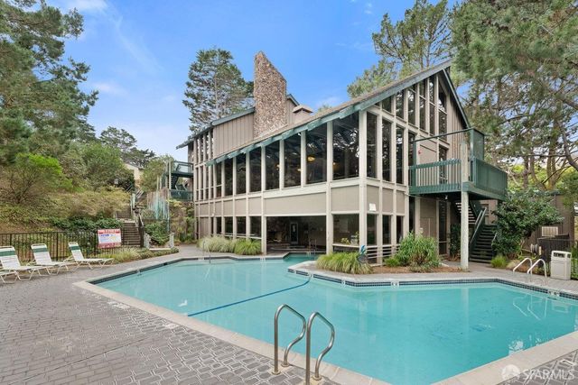 a view of a building with a swimming pool