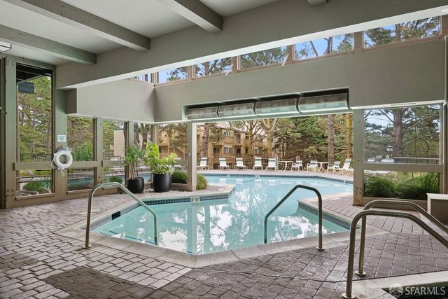 a front view of a building with garden