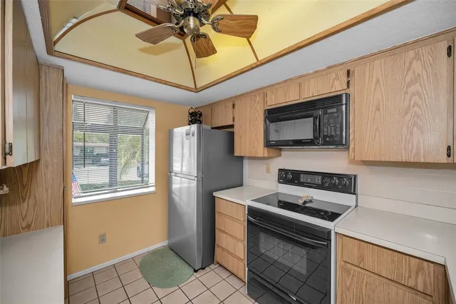 a view of green field with tree in the background