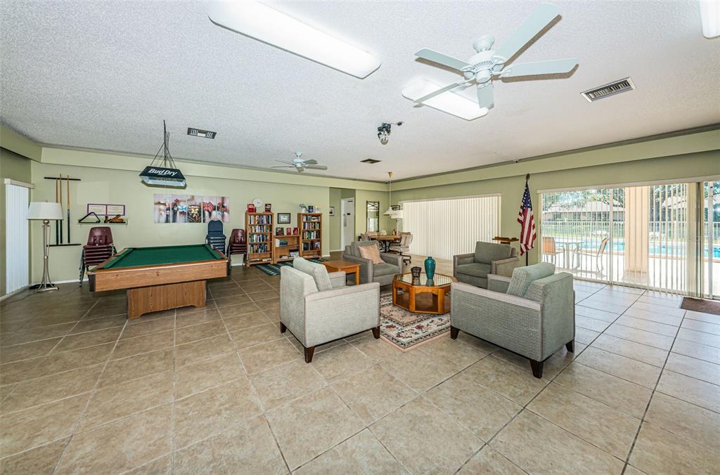 11511 113th Street, Unit 35E Largo, FL 33778 - Photo 71 of 77 a living room with furniture and kitchen view