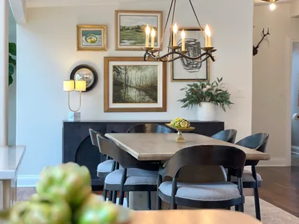a view of a dining room with furniture and chandelier