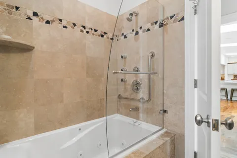 a bathroom with a shower and a bathtub