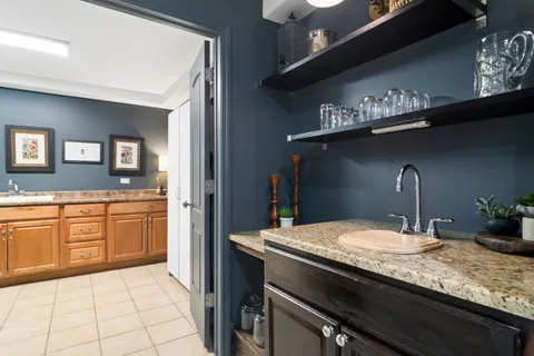 a kitchen with a sink and cabinets